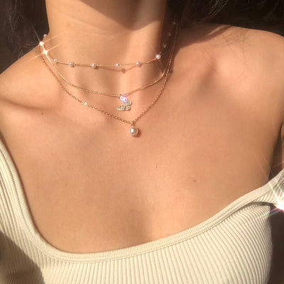Collar de Mariposa de Cristal y Perlas en Oro
